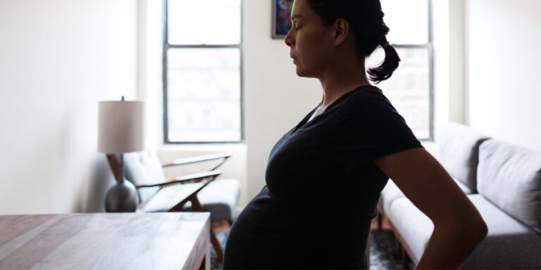 pregnant woman doing breathing exercise