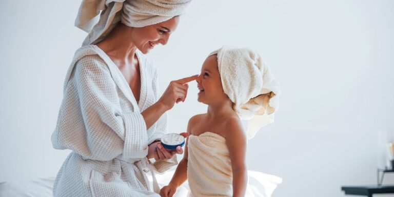 mom and daighter after bath with towels on their heads